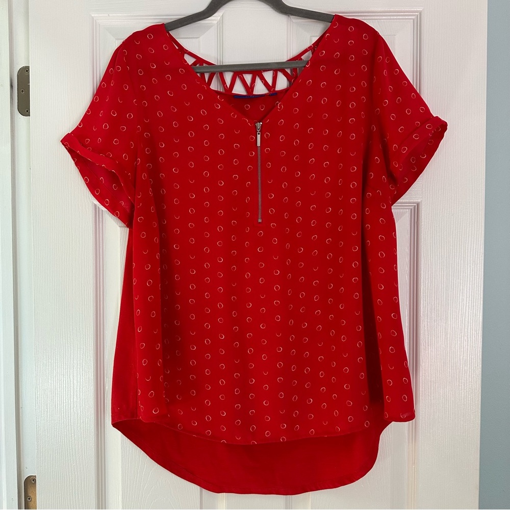 1X red short-sleeve blouse with zipper, cutouts on back collar, & white pattern